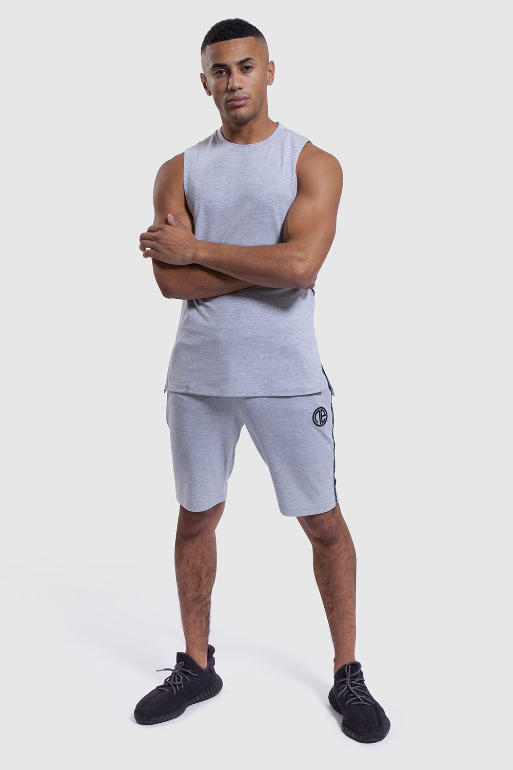 athlete wearing mens gym shorts and vest