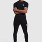 model wearing Firestone II top and gym joggers in black