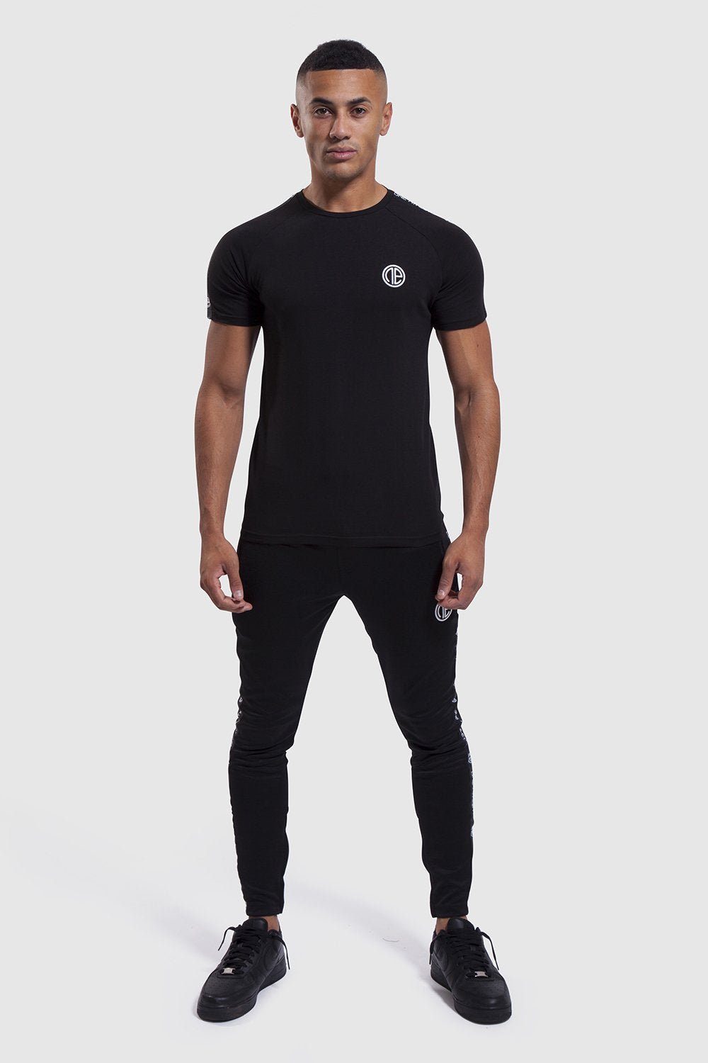 gym top and joggers in black by one athletic