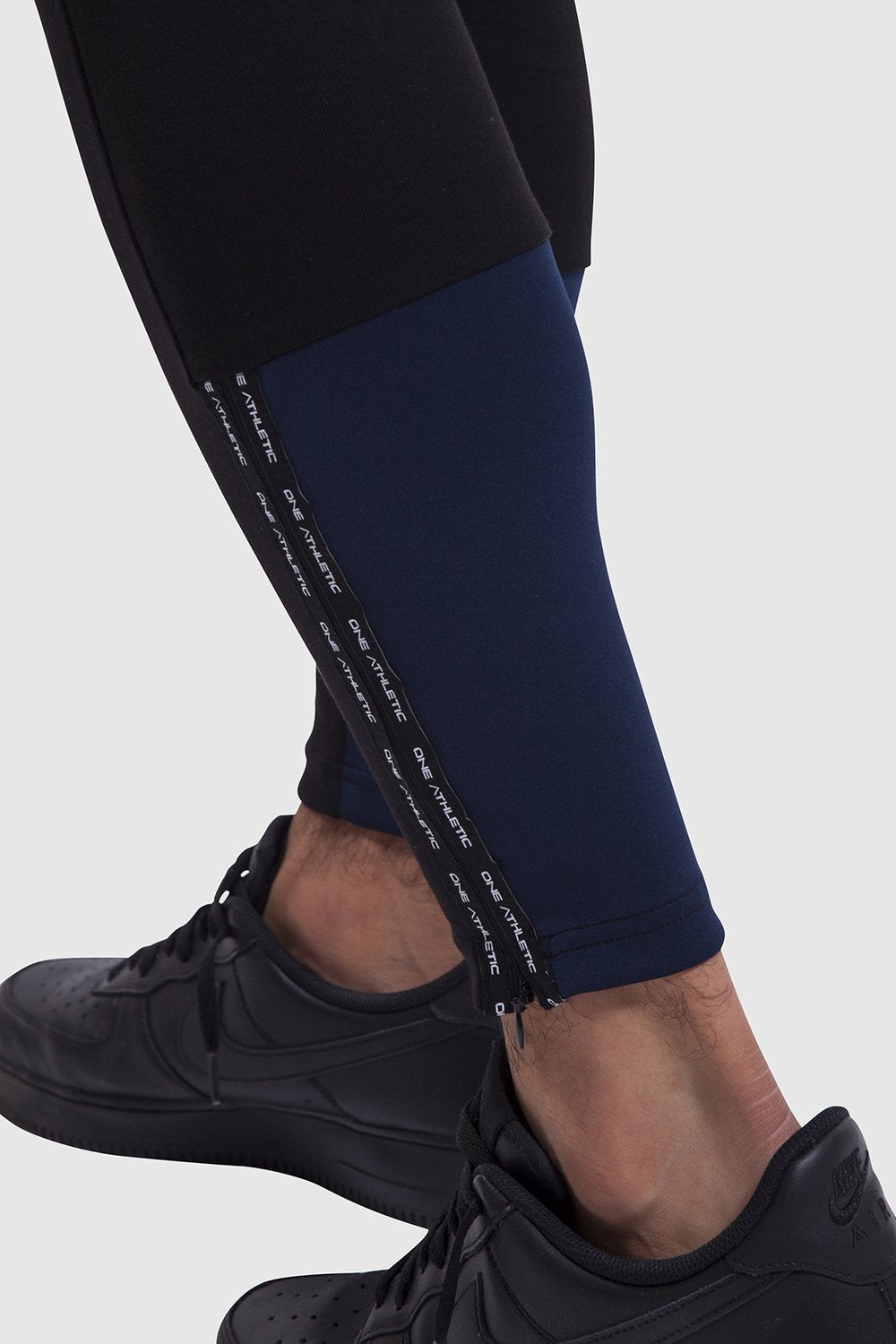 Calf detail of mens black gym joggers