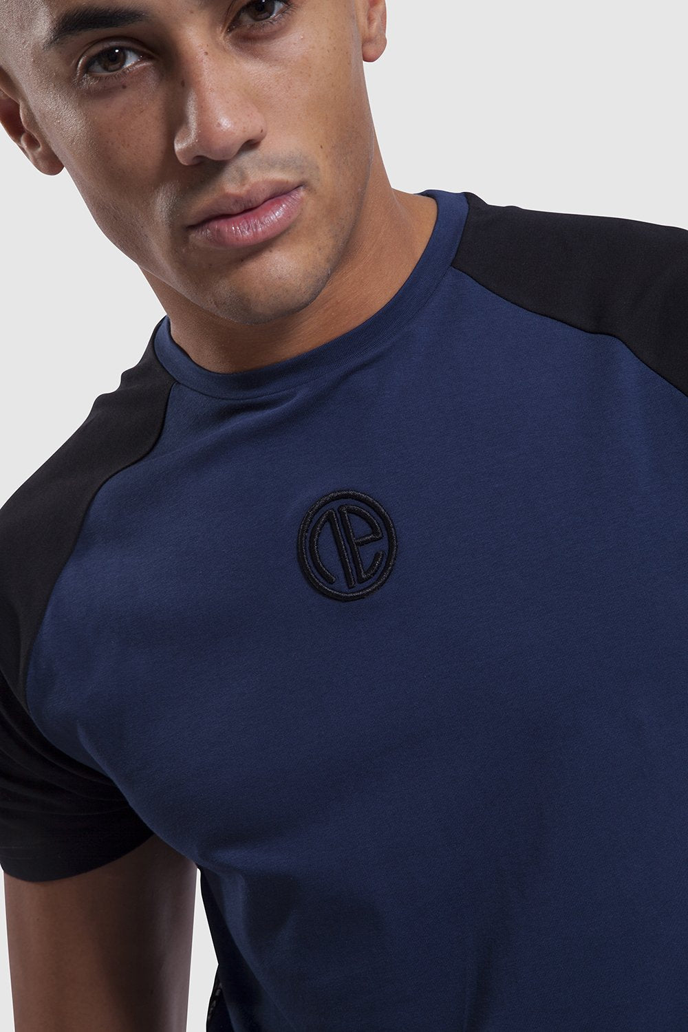 Close up on One Athletic branding on mens training top