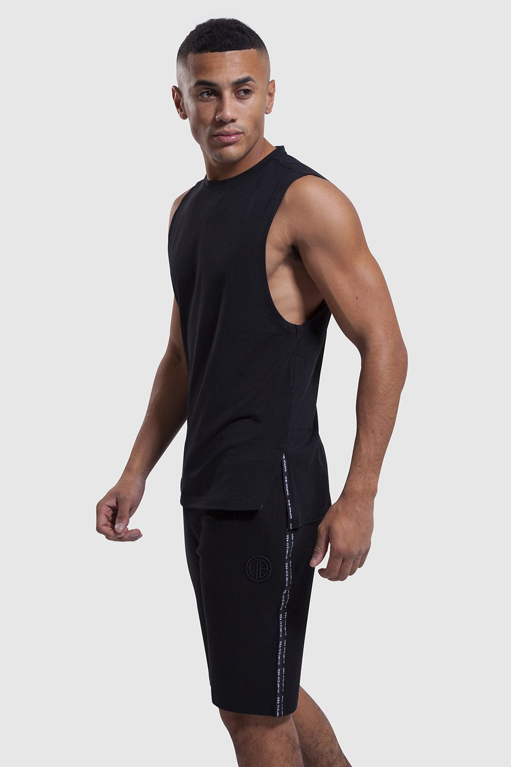 side profile of Iverson II vest and mens shorts set