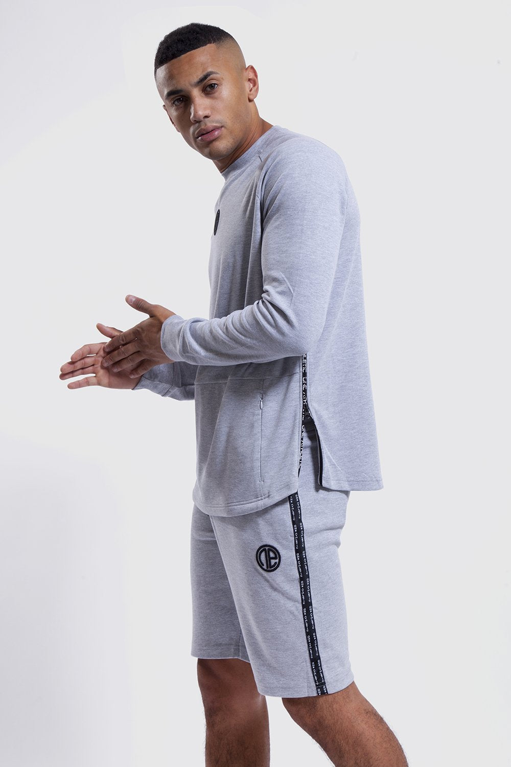 side detail of mens gym shorts and top