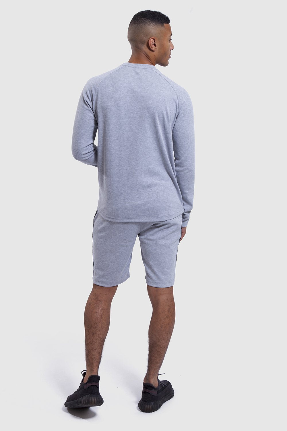 back profile of mens gym top and shorts set