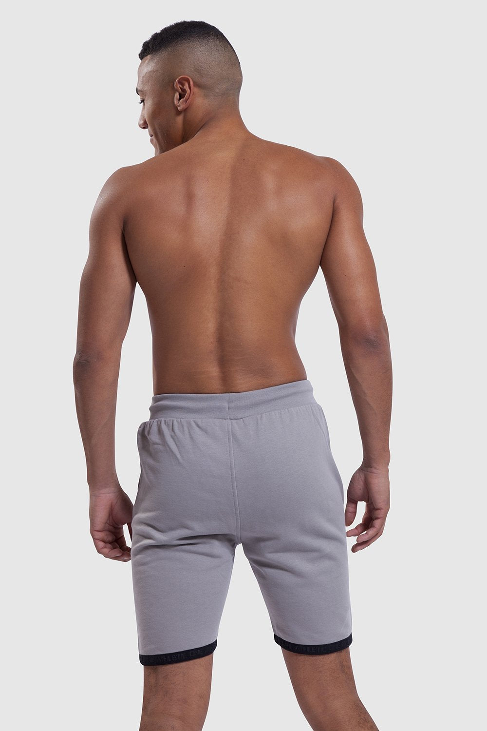 Back profile of grey gym shorts