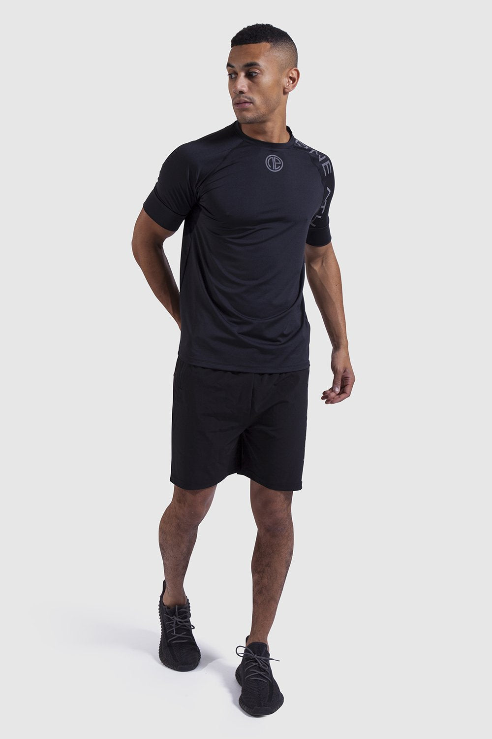 model wearing training top and shorts