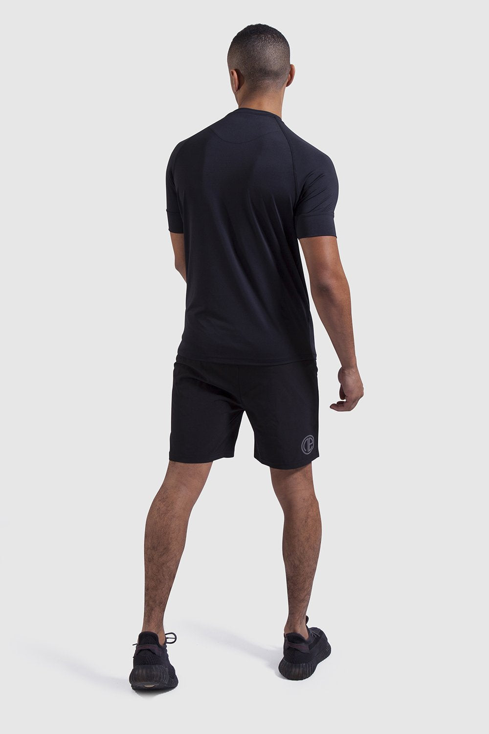 Back view on mens gym t-shirt & shorts