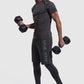 Person lifting 2 dumbbells in mens gym t-shirt and shorts