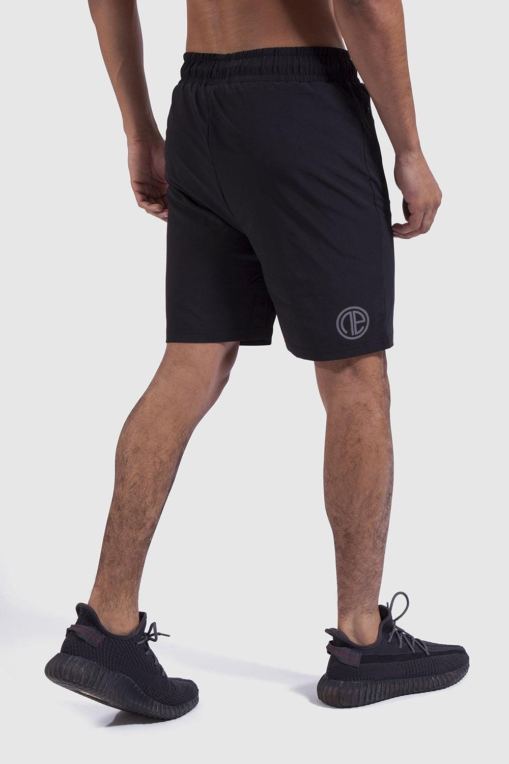 Back detail and logo of mens training shorts